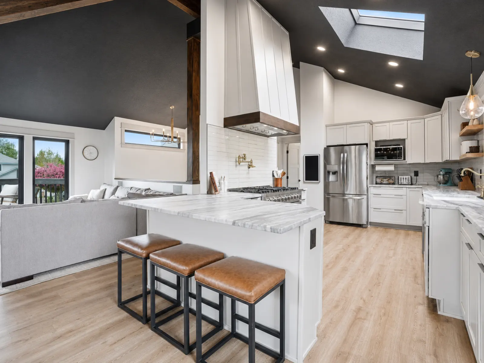 Modern farmhouse kitchen and living room remodel by Almog Construction in Bend, Oregon.