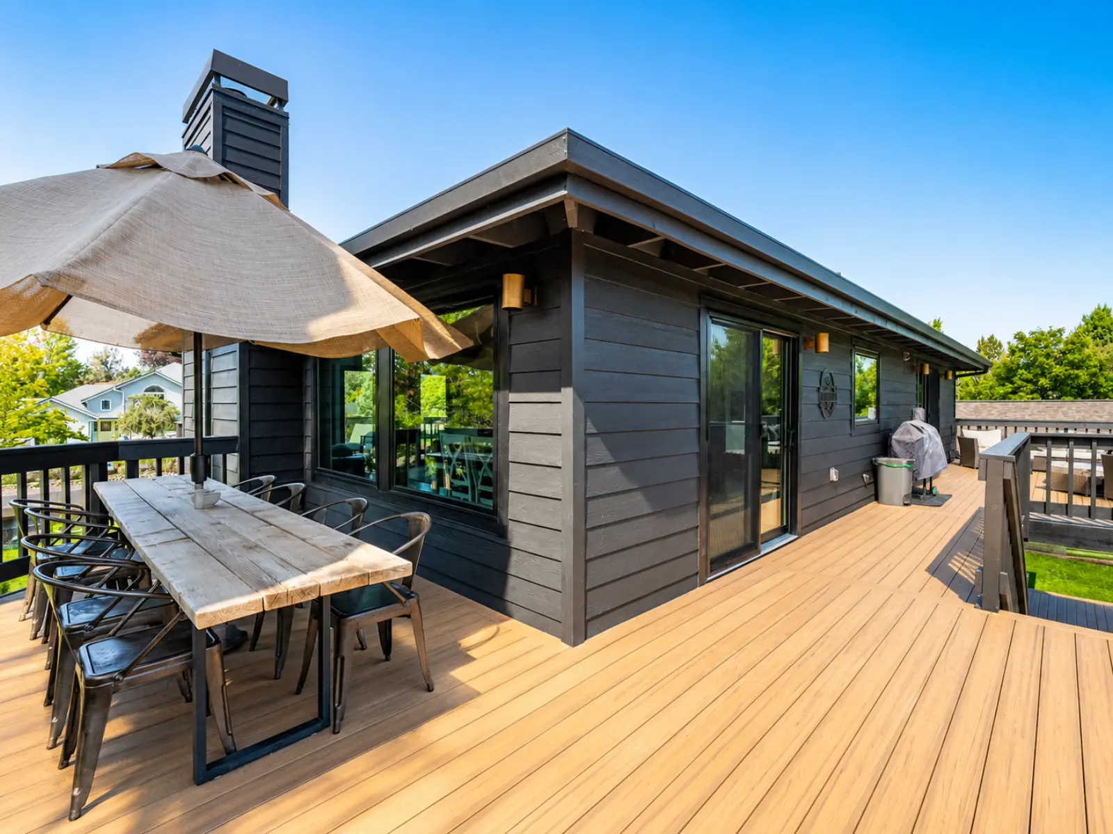 Modern outdoor deck with dining area by Almog Construction in Central Oregon.
