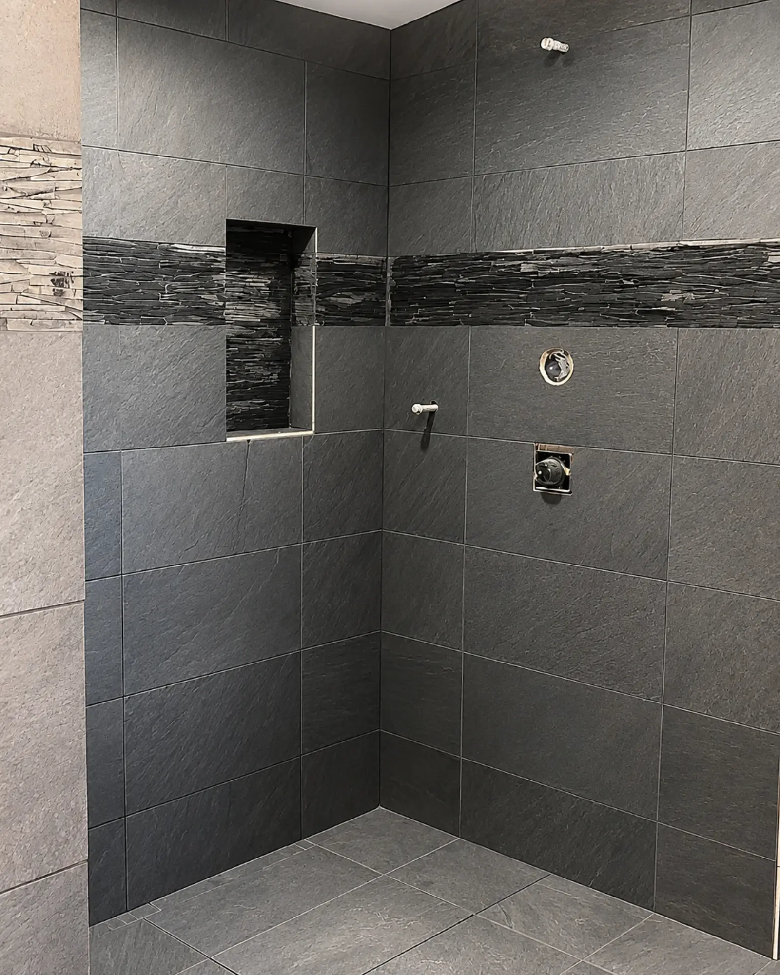 Modern slate shower in progress built by Almog Construction in Central Oregon.