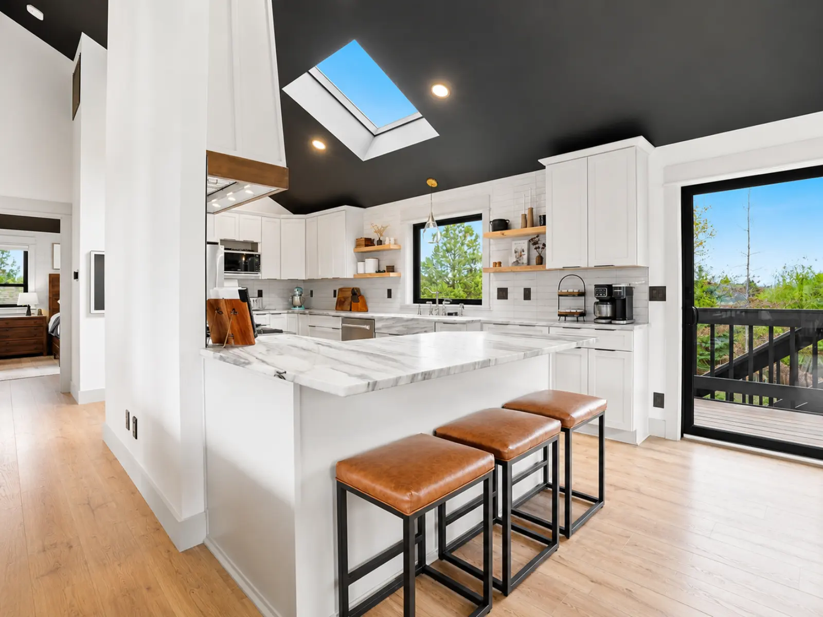 Modern kitchen remodel with skylight and island by Almog Construction in Redmond, Oregon.